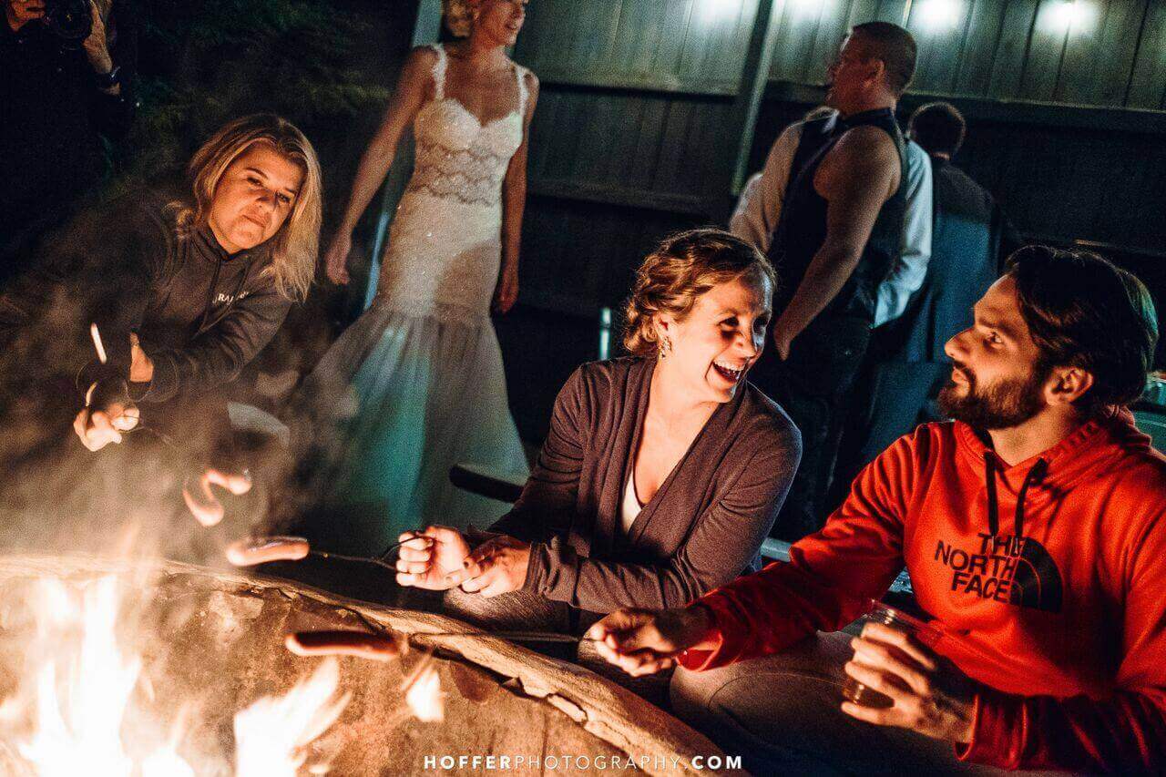 after-party-fire-pit-hoffer-photography A group of people sitting around a fire pit.