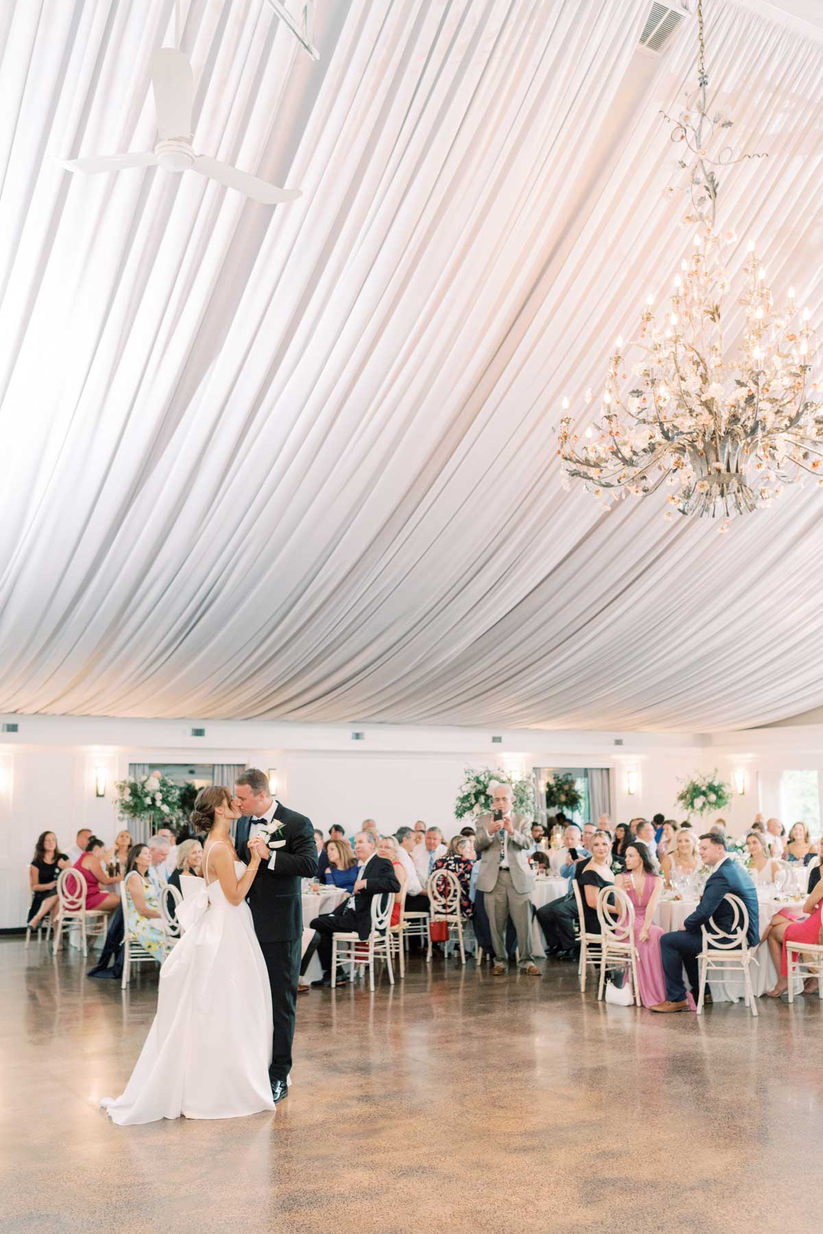 lake-house-inn-ballroom-reception-Michelle-Nicholas-58 A bride and groom's first dance in a tent.